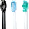 Close-up view of three toothbrush heads with different colored bristles. Produktbild-Vorschau