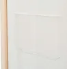 A close-up view of a cream-colored fabric pocket on a room divider. Voir les images du produit