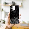 A hand holding an iPhone 12 Mini with a glittery black phone case. Náhled obrázku produktu