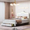 A bedroom scene with a white bed, pink curtains, and a chandelier. Voir les images du produit