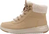 A side view of a tan Skechers boot with a cream-colored sherpa lining. Voir les images du produit