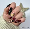 A hand with decorated nails is shown in front of a sparkly gold star. Produktbild-Vorschau