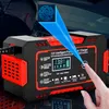 A person's hand is shown interacting with a car battery charger. A blue overlay highlights a fingerprint scanner. Podgląd zdjęcia produktu