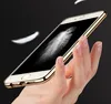 A hand holding a gold smartphone with a feather graphic on the screen, against a black background with floating feathers. Produktbild-Vorschau