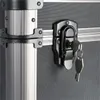 A close-up view of a locked case with a key in the lock. Produktbild-Vorschau