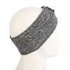 A gray heathered headband displayed on a white mannequin head. Náhľad obrázku produktu