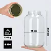 A hand holds a glass jar with a gold lid next to measurement indicators. Another hand supports the bottom of the jar. Podgląd zdjęcia produktu