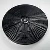 A close-up overhead shot of a black circular charcoal filter for a range hood. Produktbild-Vorschau