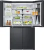The interior of an open refrigerator is shown, displaying various food items and beverages. Produktbild-Vorschau