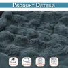 A close-up texture shot of a dark gray plush blanket, with four marketing icons at the bottom. Produktbild-Vorschau