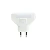A white night light with a switch, plugged into an outlet. Voir les images du produit