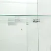 A close-up view of a glass display cabinet door, showing a hinge and two white circular objects on a shelf. Produktbild-Vorschau