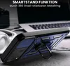 A close-up of a phone case with a stand, placed on a desk next to headphones and a laptop. Produktbild-Vorschau