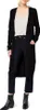 A woman wearing a black cardigan, white top, and black jeans, standing against a white background. Produktbild-Vorschau