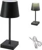Two table lamps and a USB cable are shown against a white background. The lamp on the left is black and the lamp on the right is gray and illuminated. Produktbild-Vorschau