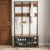 A hallway with a wooden door and a coat rack with shoe storage. Podgląd zdjęcia produktu
