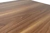 A close-up view of a wooden surface, likely a table. Náhled obrázku produktu