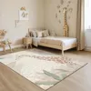A child's bedroom with a bed, a rug, and decorative elements. Náhled obrázku produktu