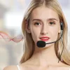 A woman wearing a headset with a microphone, with a sound wave graphic overlay. Produktbild-Vorschau