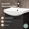 A close-up view of a white ceramic washbasin mounted on a dark wood-grain cabinet, with a chrome faucet. Text overlays highlight product features. Produktbild-Vorschau