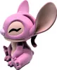 A pink figurine of the character Angel from Lilo & Stitch, sitting down with its eyes closed. Anteprima dell’immagine prodotto