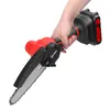 A hand holding a mini electric chainsaw. Náhľad obrázku produktu