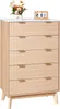 A wooden chest of drawers with decorative front panels and gold handles, topped with a vase of flowers and a wooden calendar block. Voir les images du produit