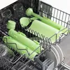 A dishwasher rack filled with kitchen utensils and some glass jars. Voir les images du produit