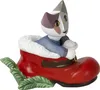 A ceramic figurine of a cat sitting in a red boot with green leaves. Anteprima dell’immagine prodotto