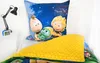 A child's bedding set featuring characters from the "Biene Maja" (Maya the Bee) franchise is displayed on a bed. Produktbild-Vorschau