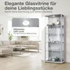A modern living room with a sofa and a glass display cabinet. Produktbild-Vorschau