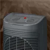 Close-up of the top controls of a gray electric heater. Anteprima dell’immagine prodotto