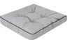A square cushion with tufted detailing and a black trim. Náhled obrázku produktu