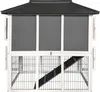 A front view of a two-story rabbit hutch with a sloped roof and a ramp leading to the upper level. Podgląd zdjęcia produktu