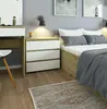 A bedroom scene with a nightstand next to a bed. Produktbild-Vorschau
