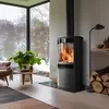 A modern living room with a fireplace, large window overlooking a snowy landscape, and furniture. Produktbild-Vorschau