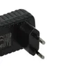 A close-up shot of a black power adapter with European-style prongs. Produktbild-Vorschau