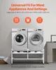 A white washing machine stand with two appliances on top, a washing machine and a dryer, and storage shelves below. The background is a plain light gray wall. Voir les images du produit