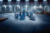 A collection of Bosch toolboxes and equipment arranged in a warehouse-like setting. Podgląd zdjęcia produktu