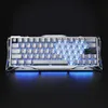 A white gaming keyboard with blue backlighting is shown from a slightly elevated front-diagonal angle against a black background. Produktbild-Vorschau