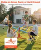 Children playing on a seesaw in a backyard. Voir les images du produit