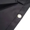 A close-up view of a black tarp or cover with a metal grommet. Produktbild-Vorschau