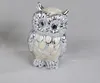A small decorative owl figurine. Produktbild-Vorschau