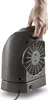 A hand holding a portable electric heater. Podgląd zdjęcia produktu