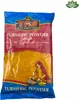 A bag of turmeric powder with a graphic of a woman grinding spices. Produktbild-Vorschau