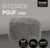 A gray corduroy pouf is shown against a plain gray background, with text overlays highlighting its features. Produktbild-Vorschau