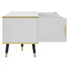 A white TV cabinet with gold accents and black legs, shown from the side with one door open. Podgląd zdjęcia produktu