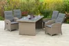 A patio set with a table and four chairs is arranged on a paved patio, with a garden in the background. Produktbild-Vorschau