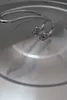 A close-up view of the lid of a stainless steel pot. Produktbild-Vorschau