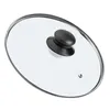 A single glass lid with a black handle and a silver rim, shown from a diagonal angle on a white background. Voir les images du produit